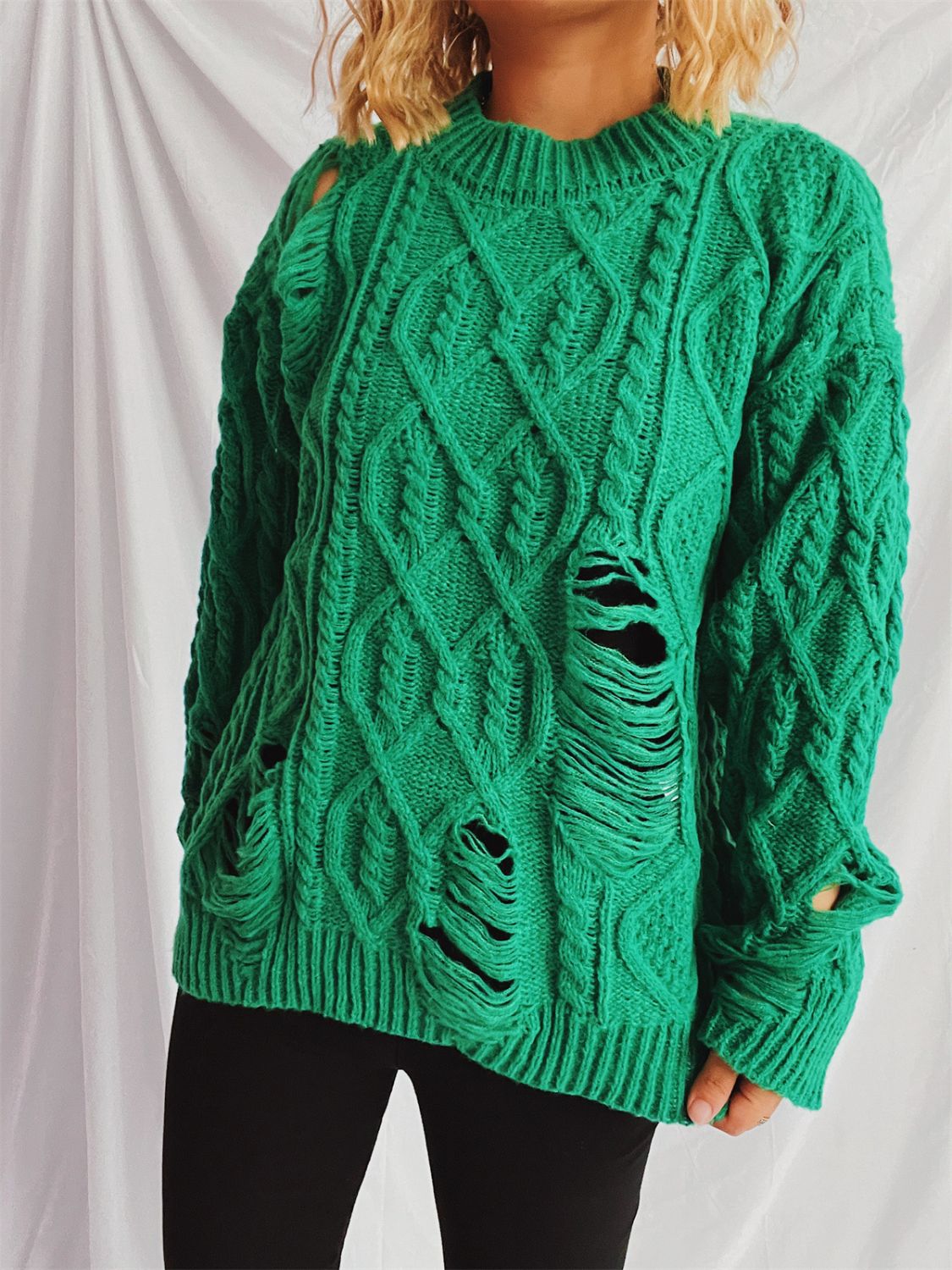 Distressed cable-knit round neck long sleeve sweater