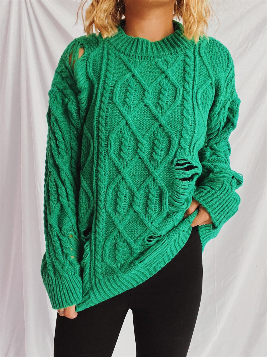 Distressed cable-knit round neck long sleeve sweater