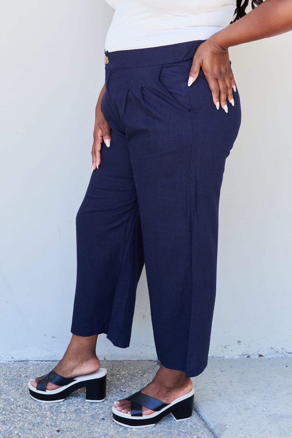 And the why in mix full size pleated detail linen pants in dark navy