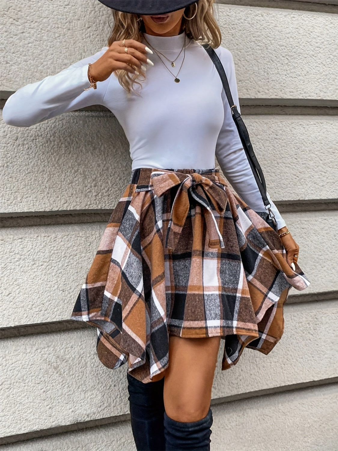 Tied plaid asymmetrical hem skirt