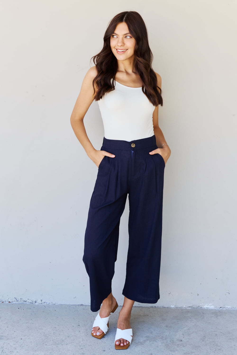 And the why in mix full size pleated detail linen pants in dark navy