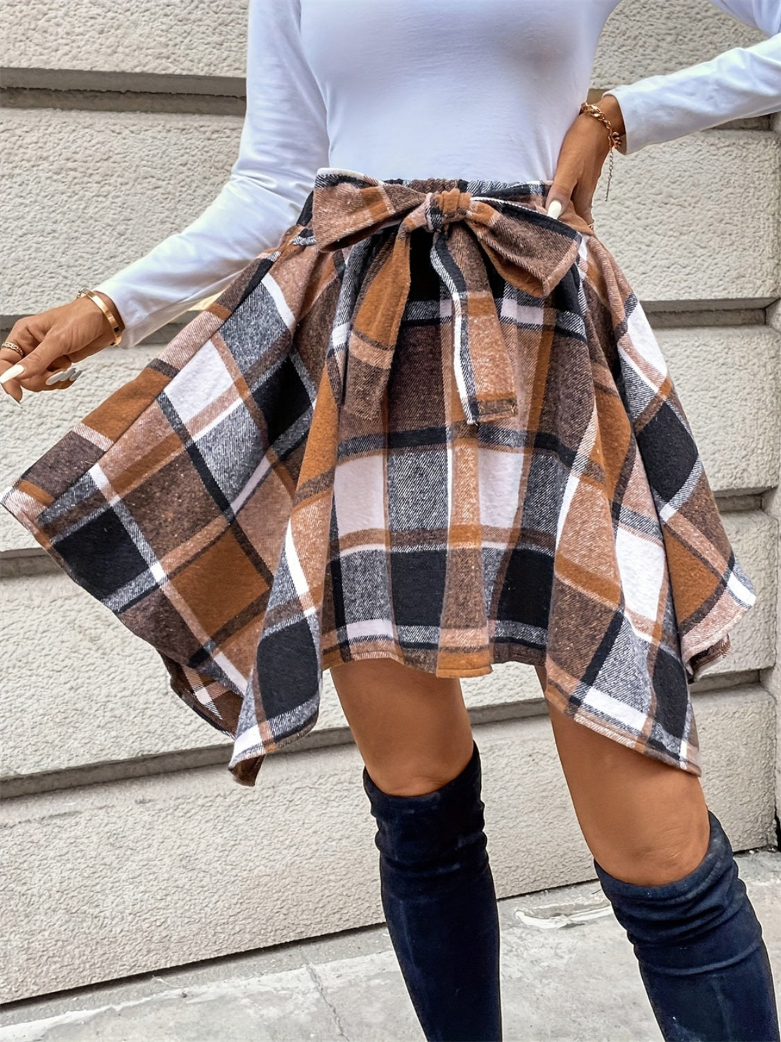 Tied plaid asymmetrical hem skirt