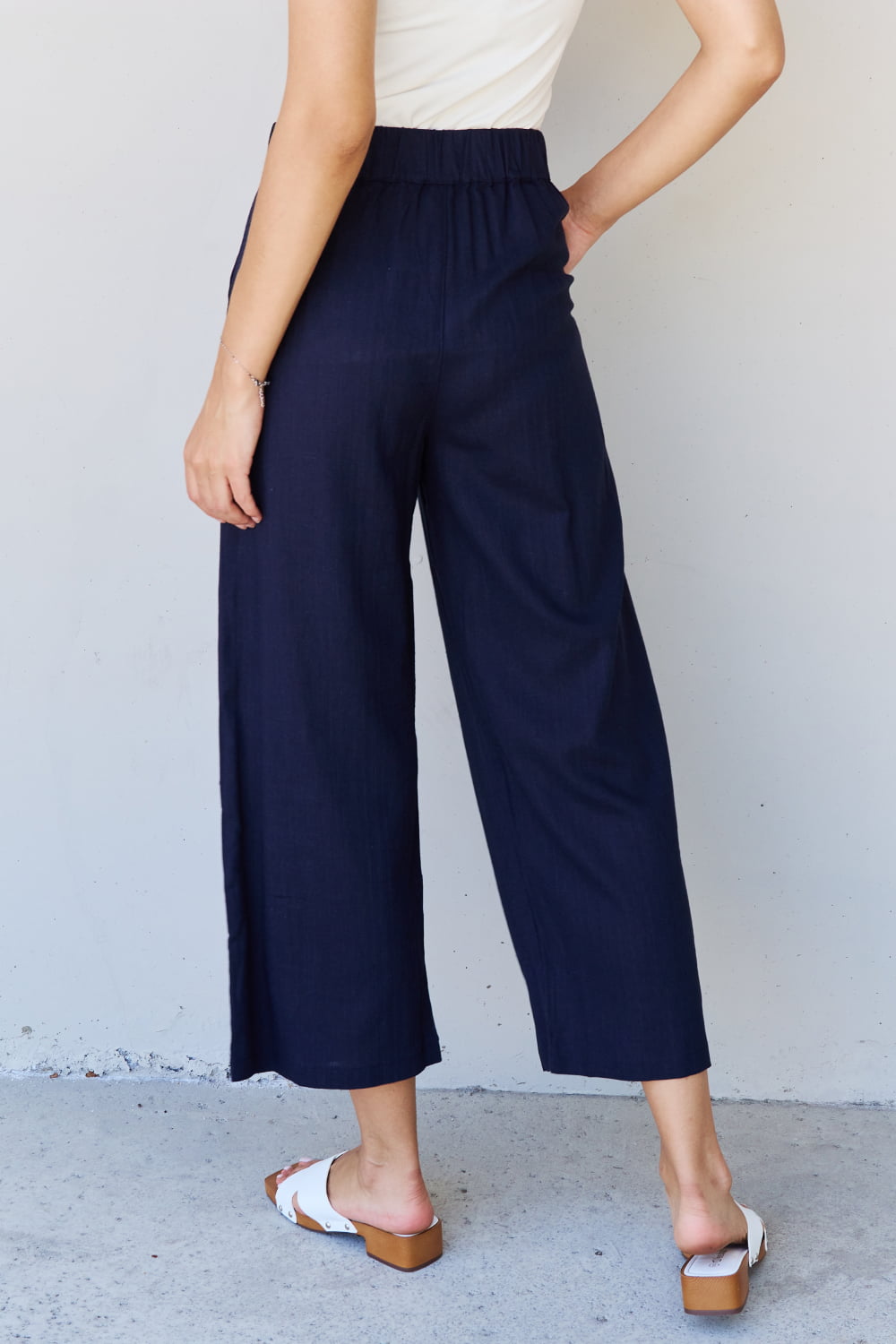 And the why in mix full size pleated detail linen pants in dark navy