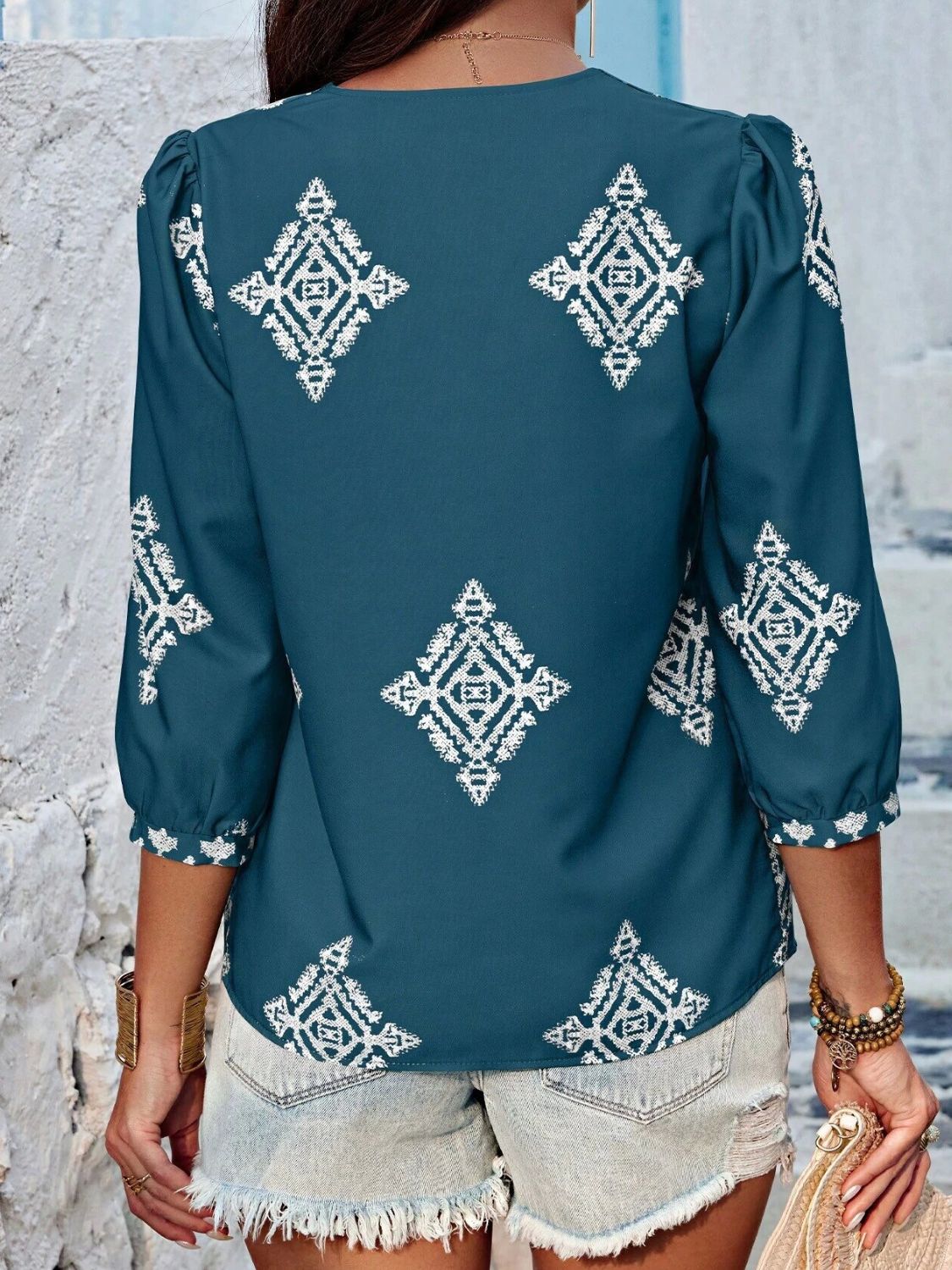 Printed v-neck three-quarter sleeve blouse