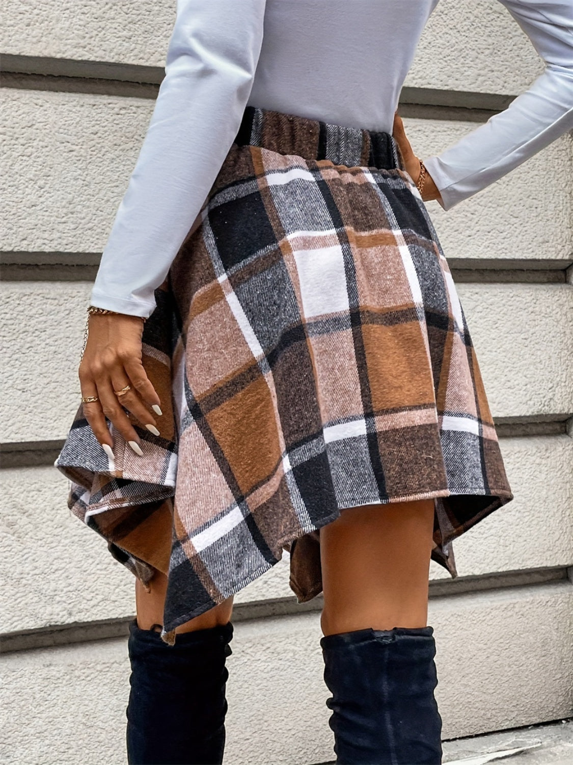 Tied plaid asymmetrical hem skirt