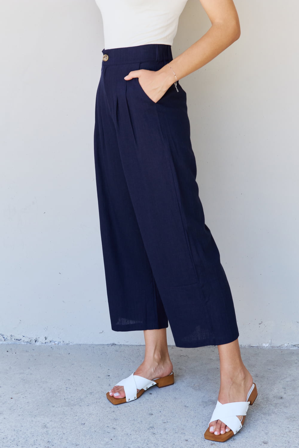 And the why in mix full size pleated detail linen pants in dark navy