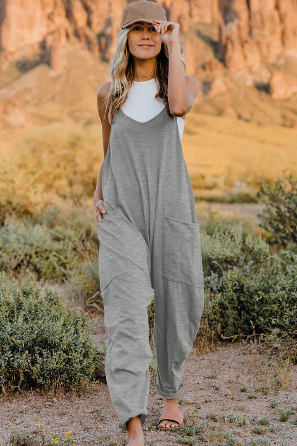 Gray loose-fitting jumpsuit with wide legs and a sleeveless design.